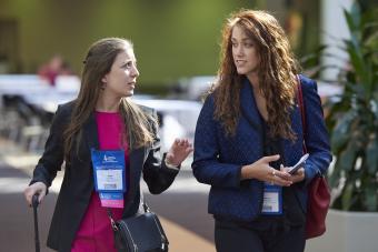 2 women walking and talking