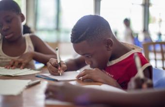 young african american students doing schoolwork