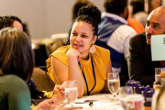 Division leaders having dialogue at a table at CEC 2022